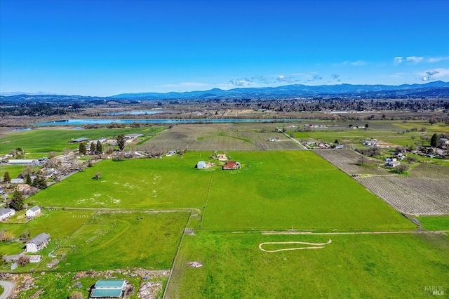 birds eye view of property with a rural view and a mountain view