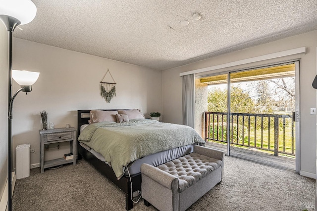 carpeted bedroom featuring a textured ceiling, baseboards, and access to outside