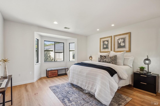 bedroom featuring visible vents, recessed lighting, baseboards, and light wood-style floors