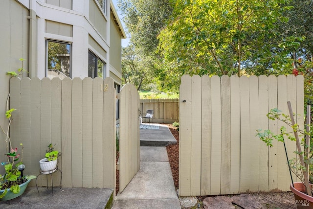 view of side of property featuring fence