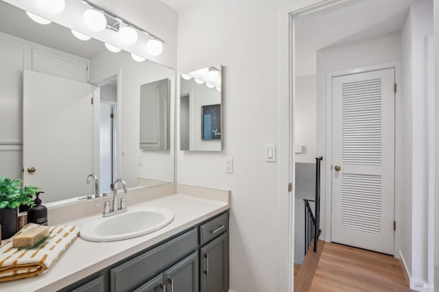 bathroom with vanity and wood finished floors