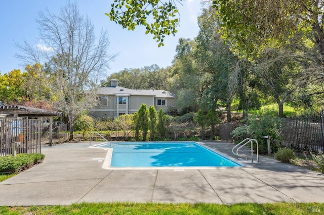 view of pool featuring a fenced in pool, a patio, and fence