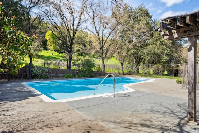 view of pool featuring a patio, a fenced in pool, and fence