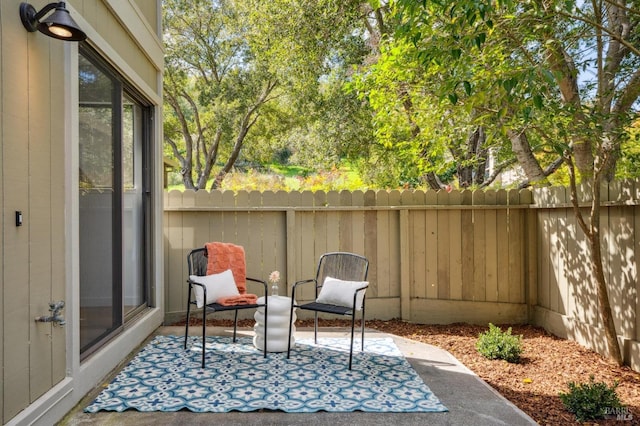 view of patio / terrace featuring fence