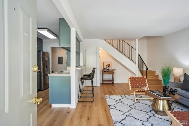 interior space with light wood-type flooring and stairs