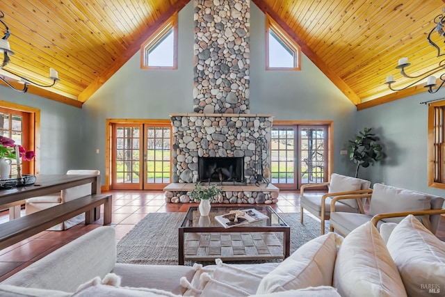 living area featuring tile patterned flooring, a fireplace, wood ceiling, and lofted ceiling