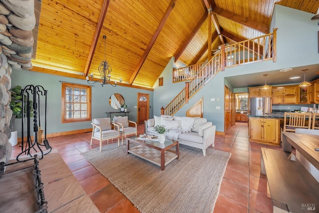 living room with baseboards, a chandelier, stairway, beamed ceiling, and wooden ceiling