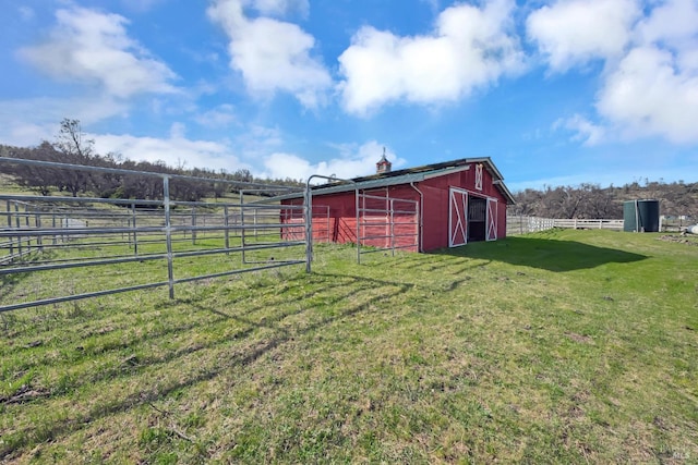 view of outdoor structure featuring an exterior structure, a rural view, and an outdoor structure