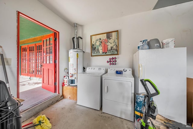 washroom with gas water heater and washer and dryer