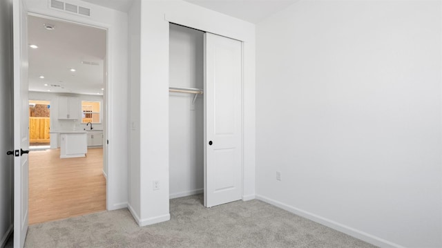 4040 Molten Creek Way, Roseville, CA 95747 - unfurnished bedroom featuring a closet, light carpet, baseboards, a sink, and recessed lighting