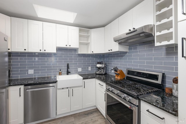 kitchen featuring open shelves, a sink, stainless steel appliances, white cabinets, and under cabinet range hood