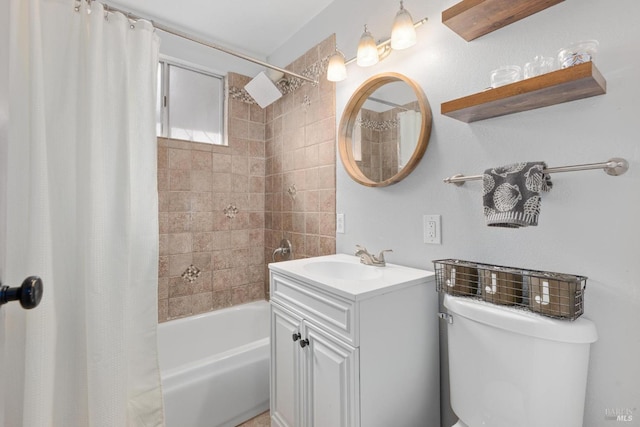 bathroom featuring toilet, vanity, and shower / tub combo