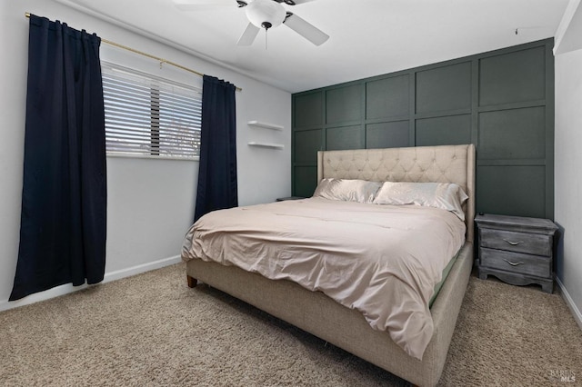 bedroom with a ceiling fan, baseboards, and light carpet