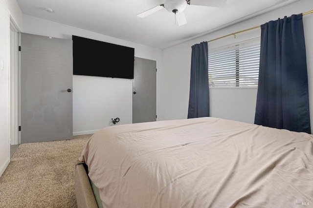 bedroom with a ceiling fan and carpet floors