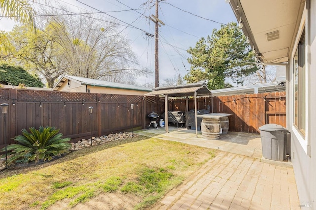 view of yard with a gazebo, a patio area, and a fenced backyard