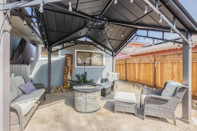 view of patio featuring an outdoor living space and fence