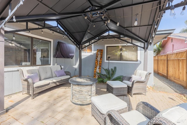 view of patio / terrace featuring fence and an outdoor hangout area