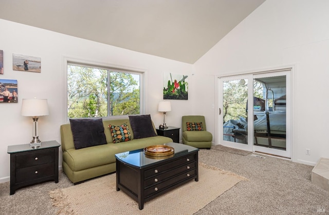 carpeted living room featuring vaulted ceiling