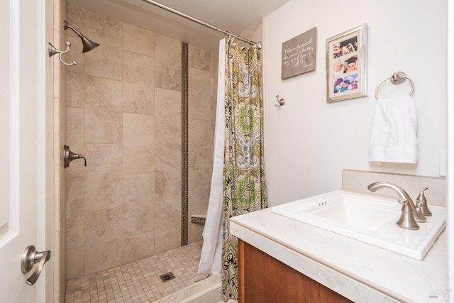 bathroom with vanity and a shower stall