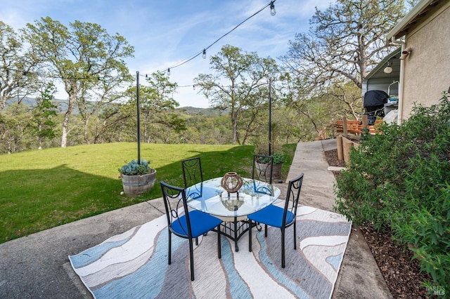 view of patio featuring outdoor dining area