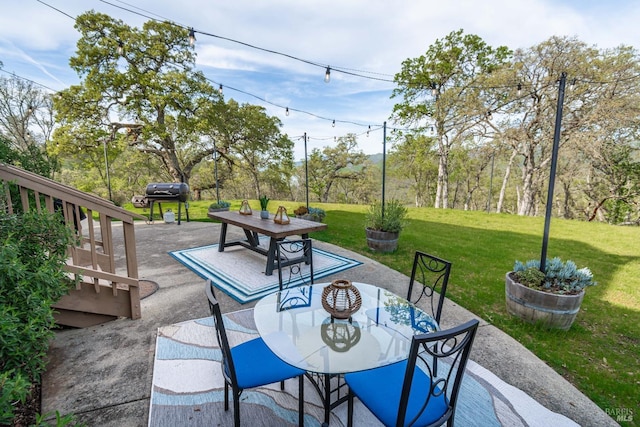 view of patio featuring outdoor dining space