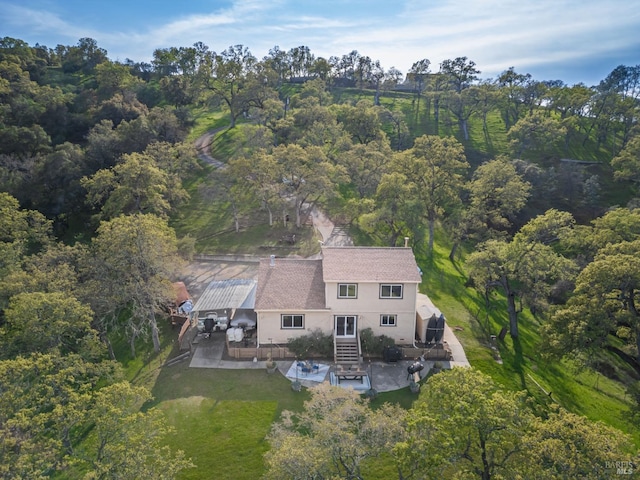 bird's eye view featuring a forest view