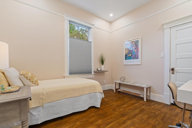 bedroom with recessed lighting, baseboards, and wood finished floors