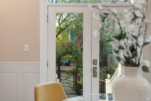 1133 Eggleston St, Napa, CA 94559 - doorway to outside with wainscoting and a decorative wall