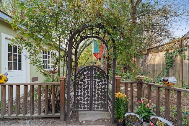 view of gate featuring fence