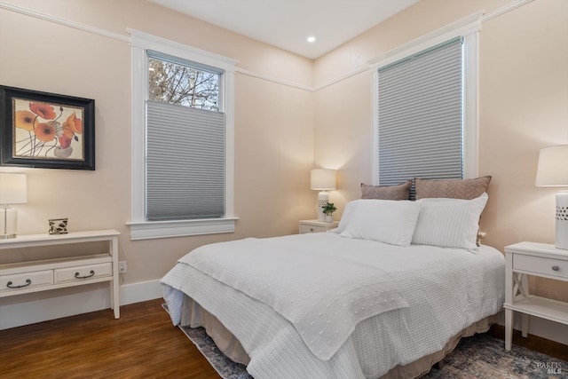 bedroom with recessed lighting, baseboards, and wood finished floors