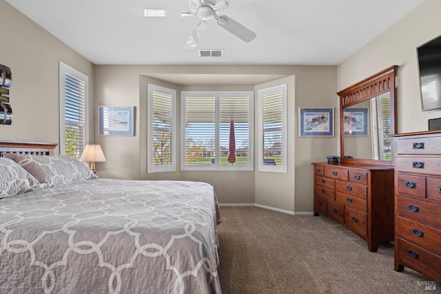 bedroom featuring baseboards, visible vents, carpet floors, and ceiling fan