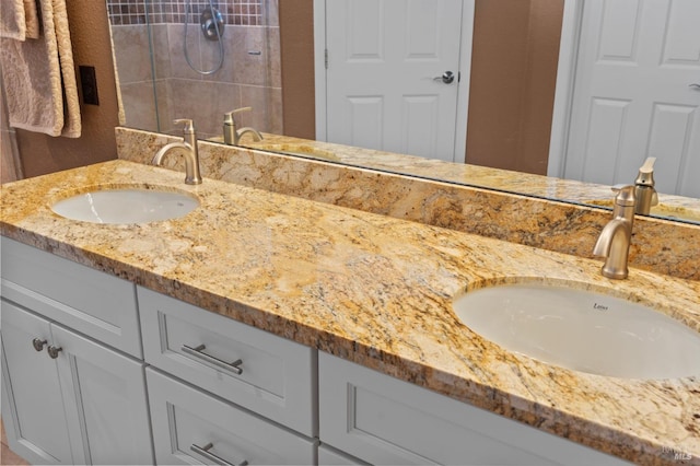 full bath featuring double vanity and a sink