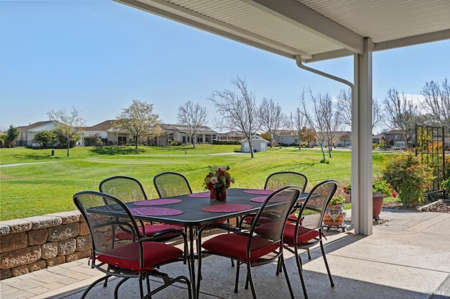 view of patio featuring a residential view and outdoor dining space