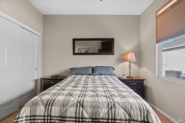 carpeted bedroom with baseboards