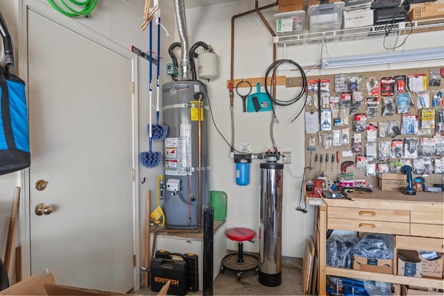 utility room with strapped water heater