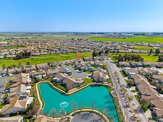 birds eye view of property with a residential view and a water view