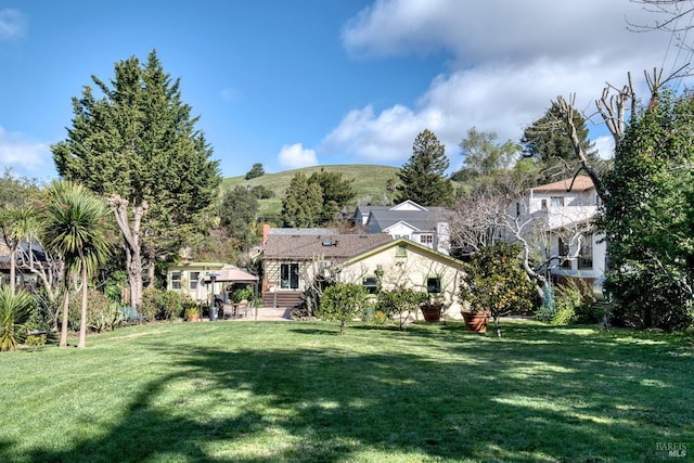 29 Shell Rd, Mill Valley, CA 94941 - view of front of home with a front lawn, a patio area, a mountain view, and a chimney