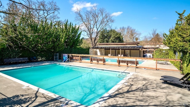 pool featuring a patio area