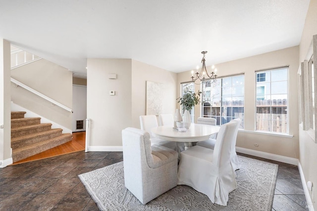 dining space with visible vents, an inviting chandelier, stairs, and baseboards