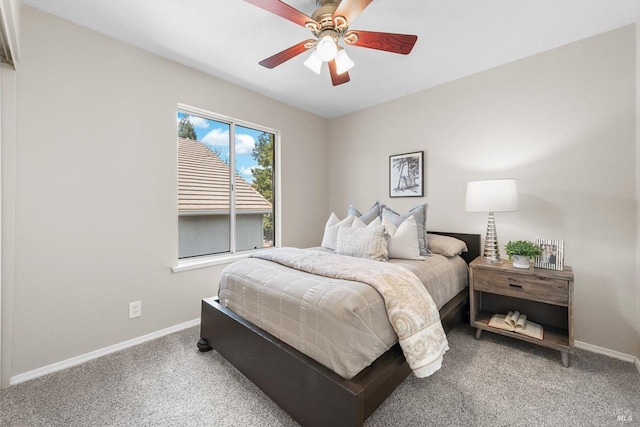 carpeted bedroom featuring a ceiling fan and baseboards