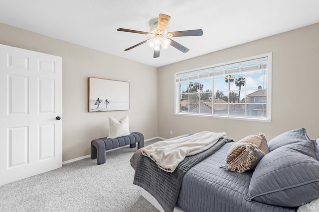 bedroom featuring a ceiling fan, baseboards, and carpet floors