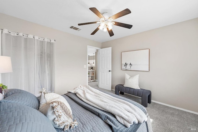 carpeted bedroom featuring baseboards, visible vents, and ceiling fan