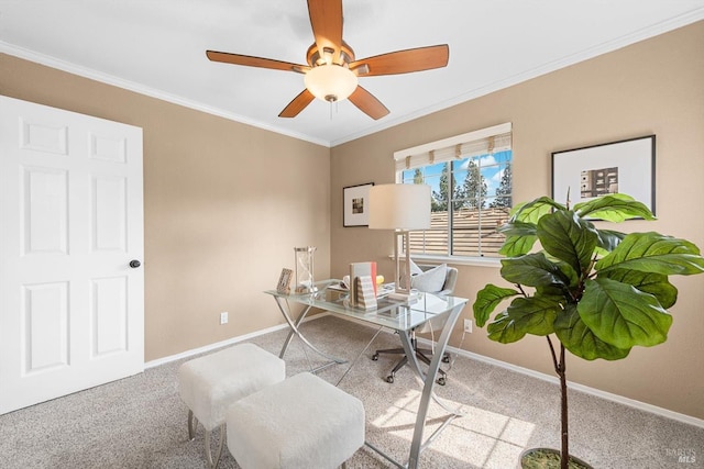 carpeted office with baseboards, ornamental molding, and a ceiling fan