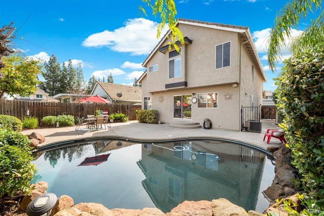 view of pool with a patio, a fenced backyard, and a fenced in pool