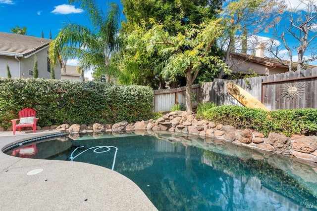 view of pool featuring a fenced backyard