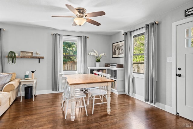 dining room featuring wood finished floors, baseboards, and ceiling fan