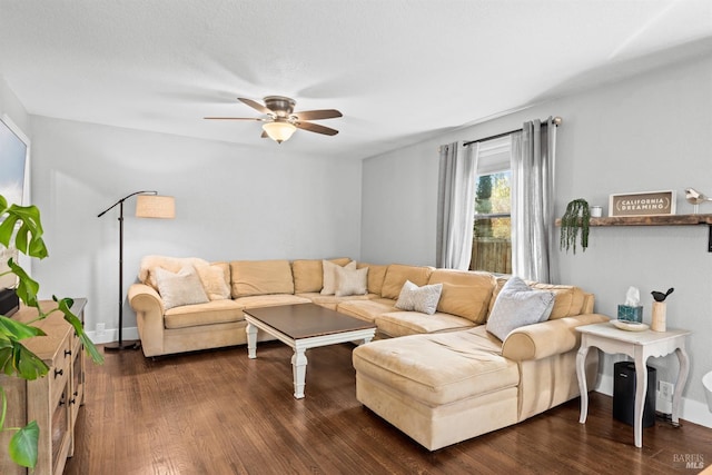 living area with dark wood finished floors and ceiling fan