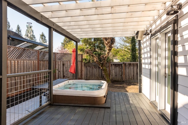 deck with a pergola, a fenced backyard, and hot tub deck surround