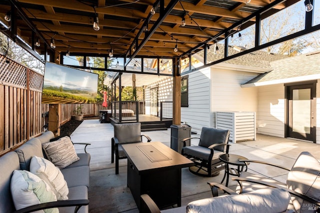 view of patio / terrace with an outdoor hangout area and fence