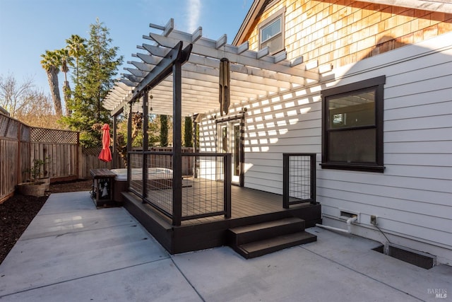 wooden deck with a patio area, a pergola, and a fenced backyard